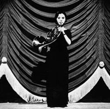 Woman Playing French Horn
