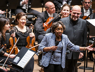 Tania León speaking at the premiere of “Stride.” Photo by Chris Lee/Courtesy New York Philharmonic