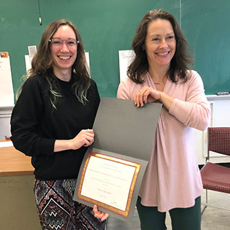 Carly Graham being awarded a 2019–20 Freed Scholarship by Anthropology Chair, Professor Jillian Cavanaugh.