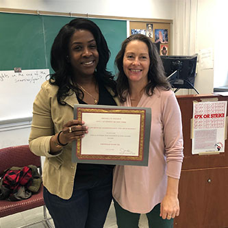 Denille Samuel being awarded a 2019–20 Freed Scholarship by Anthropology Chair, Professor Jillian Cavanaugh.
