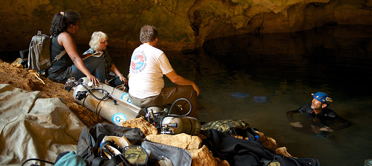Malagasy student Noromamy, Dr. Laurie Godfrey and Rosenberger welcome lead diver Phillip Lehman as he emerges in Mitoho Cave.