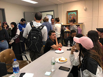 Students and faculty mingle in the anthropology lounge.