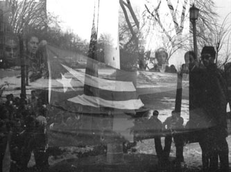 Black and Puerto Rican students took turns flying the Puerto Rican and Black Liberation flag from the Brooklyn College flagpole, circa 1969. (Photo credit Antonio Nieves '72)