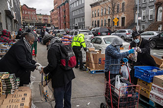 Brooklyn street-level food distribution during the early days of the lockdown.