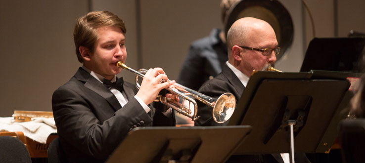 Students in our Brass Ensemble learning everything from phrasing and balance to the history of brass instruments.