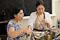 Nirmala Golder (left) and Kelly Lim make parathas, or flaky flatbreads.