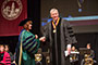 Keynote speaker Warren Lustig '99, shakes hands with Brooklyn College President Karen L. Gould at the Master's Commencement Ceremony for students graduating from the schools of Humanities and Social Sciences; Natural and Behavioral Sciences; and Visual, Media and Performing Arts. A recipient of this year's Distinguished Alumni Award, Lusting created 'TV Boot Camp,' an intensive two-week program for CUNY broadcast journalism students. 'It was my way of giving back to the college and university,' he said during his speech.