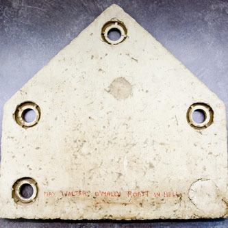 Showing signs of wear, this home plate from Ebbets Field bears the curse shared by many Brooklyn Dodgers fans: