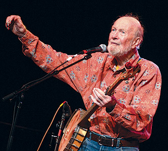 Pete Seeger performs at Brooklyn College in 2012 as part of a daylong conference commemorating the life of  singer-songwriter Woody Guthrie, sponsored by the college's H. Wiley Hitchcock Institute for Studies in American Music.