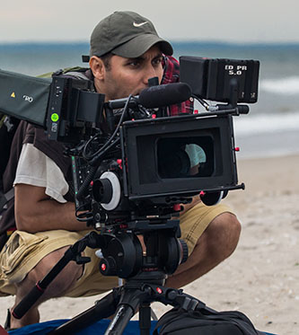 Shachar Langlev working on his new project, <em>A Scientist's Guide to Living and Dying</em>.