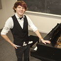 Eisenhauer standing next to a grand piano Eisenhauer standing next to a grand piano