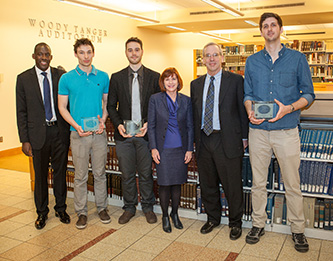 <p>Film festival winners with New York Federal Reserve President William C. Dudley, second from right, on a March 7 campus visit, and Brooklyn College President Karen L. Gould. </p>