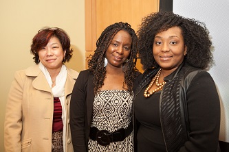 Stacey Muhammad (center) is greeted by the Women's and Gender Studies Program's Endowed Postdoctoral Fellow Zinga A. Fraser (right) and Sau-Fong Au, director of the Women's Center.