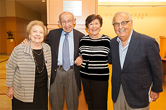 <p>Left to right: Connie Stopol, Philip Stopol '47, Irene Stein '47, and Howard Stein '47 are all smiles in front of the Stopol plaque in the Brooklyn College Library.</p>
