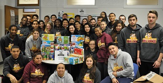 <p>Leaders of the pack: The Brooklyn College Bulldogs teamed up to collect more than half of the over 1,000 canned food items for the Thanksgiving drive. </p>