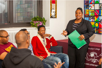 Nicole St. Clair and some of the students enrolled in the Black and Latino Male Initiative.