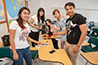 <p>Two college students from Puebla, Mexico (foreground) and three from Northern Chinese University of Technology worked on projects created to foster camaraderie among the visiting international students.</p>