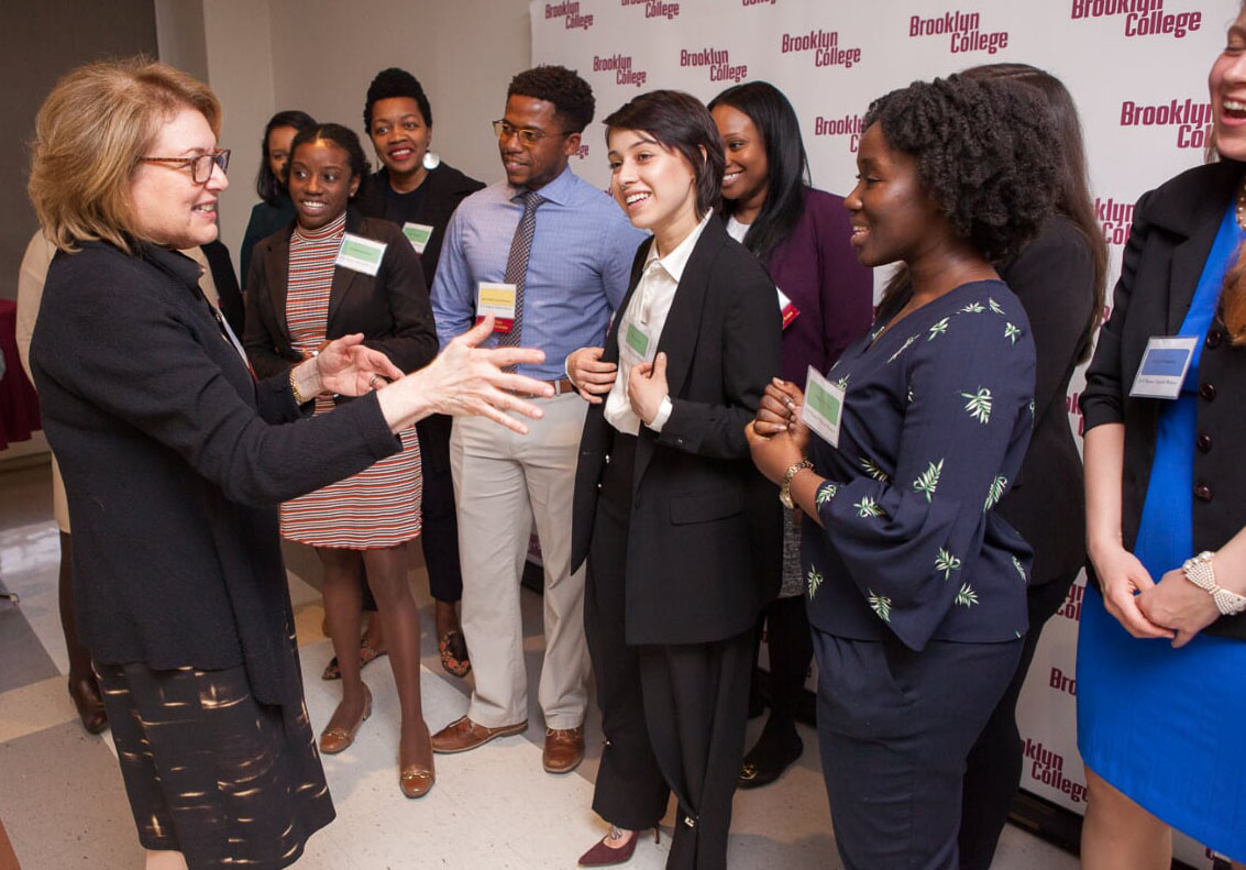 Marge Magner '69 speaks with recipients of her stipend, both past and present, at an event to mark the Magner Center's 15th anniversary.