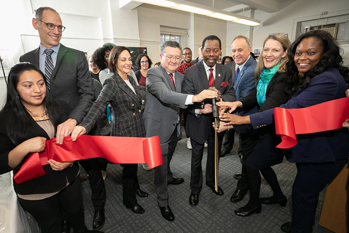 (Left to right) Brooklyn College student Hilda Lema, Dr. Alex Federman, Jaime Greenberg, Jesús Pérez '95, New York City Council member Mathieu Eugene, CUNY Chancellor Félix V. Matos Rodríguez, Brooklyn College President Michelle J. Anderson, and New York State Assembly member Rodneyse Bichotte cut the ribbon on Brooklyn College’s new Immigrant Student Success Office on Dec. 13.
