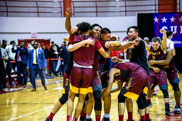 Members of the Men's basketball team celebrate their championship win against No. 2 Baruch College. Photo: Anne Curran