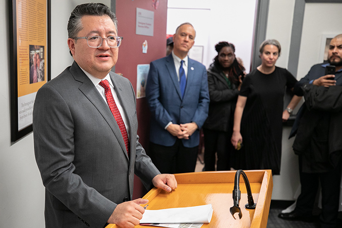 Jesús Pérez, left, at the December 2019 ribbon cutting for the Immigrant Student Success Office. CUNY Chancellor Félix Matos Rodriguez is second from left. 