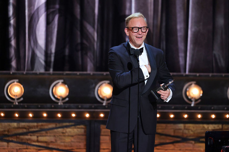 Associate Professor for performance Justin Townsend accepts the Tony Award for Best Lighting Design of a Musical for his work on <em>Moulin Rouge!</em>