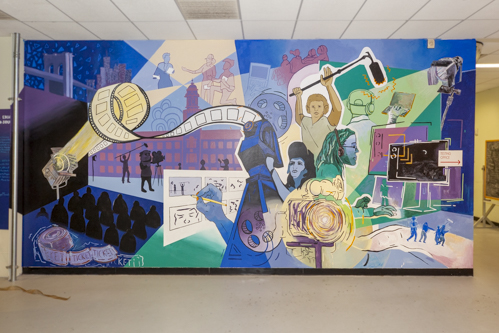  A new mural graces the walls of the Film Department thanks to a collective effort of students, faculty and staff. 