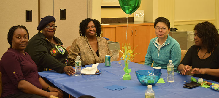 Graduating student Fedora talks with Monique Ngozi Nri, Director CUNY EDGE and other CUNY EDGE students.