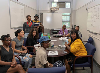 (From left) Summer Enrichment Academy students Dawne Roberts, Grey Sosa, Nofar Abergel, Brittany Wilson, Salif Soumahoro, Veteran’s Affair representative David Wells, Demetrius Garrett, Ieasha Kyser, and Tiana Boyd during the SEA closing ceremony/leadership workshop.