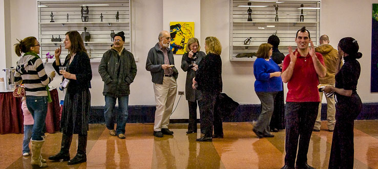 Professors and students mingle at the Student Center's Art Gallery.