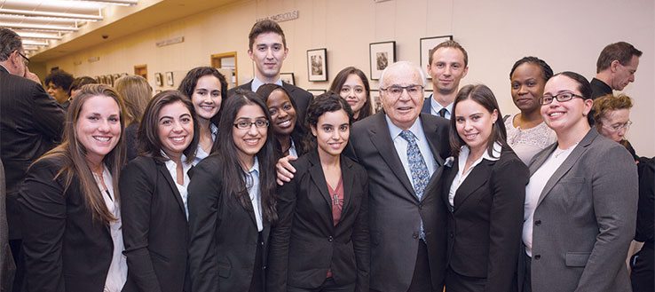 Murray Koppelman '57 with members of the Student Leadership Council for the school.