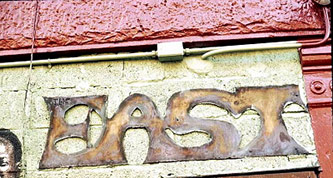 Sign over door at 10 Claver Place, Brooklyn. Photo courtesy of Basir Mchawi.