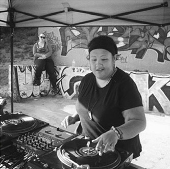 DJ Kuttin Kandi making music. Courtesy of Kuttin Kandi