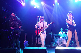 The Julie Ruin performing at Irving Plaza (left to right: Kenny Mellman, Sara Landeau, Carmine Covelli, Kathleen Hanna), photo by Helen Marie Fletcher