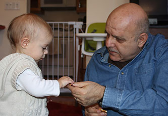 Creshevsky sharing a pretzel with Nancy Hager’s granddaughter Julia