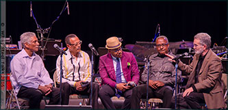 Ray (far right) in conversation with Caribbean musicians (L to R) Frankie McIntosh, David “Happy” Williams, Étienne Charles, and Garvin Blake during An Evening of Calypso Jazz at Brooklyn College, April 2016. Photograph courtesy of When Steel Talks.