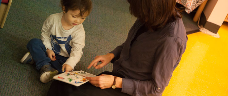 Children and teachers engage in curiosity and wonderment as they share in the magic of stories and pictures.