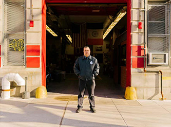 Anthony Almojera in front of his firehouse.
