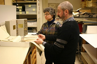 College Conservator Vyacheslav Polishchuk and Deputy Archivist Marianne Labatto at work in the conservation lab.