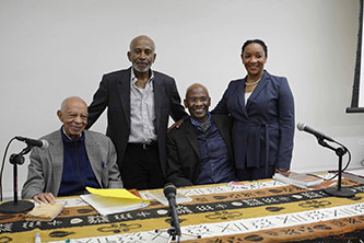 2018 Haitian Creole Language and Culture Symposium. From left to right: Father William Smarth, Menes Dejoie, Michel DeGraff and Marie Lily Cerat.