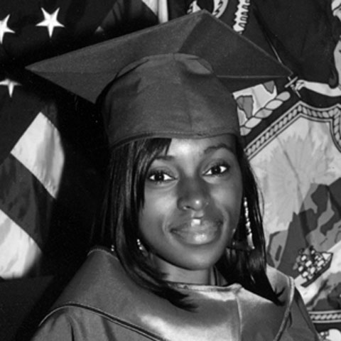 Charles in her cap and gown from her graduation at Borough of Manhattan Community College.