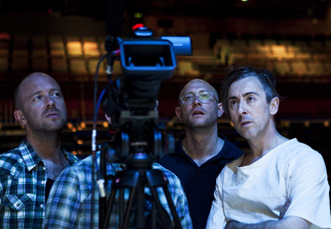 Co-directors John Tiffany (left) and Andy Goldberg (center) and actor Alan Cumming check the closed-circuit videos used in their production of Macbeth.
