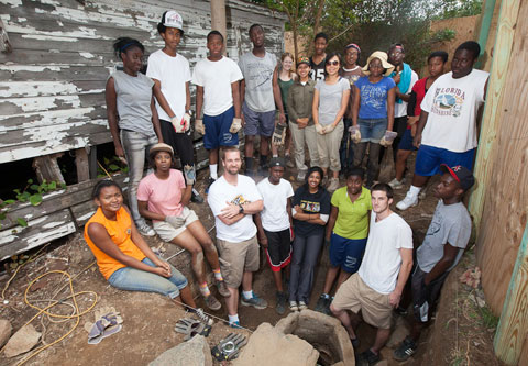 Students gather around the cistern at the historic Lott House.