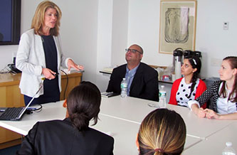 Executive Director Human Resources at Estée Lauder Irene Waxman '70 offers valuable advice to Brooklyn College undergraduates during a company visit on June 13.