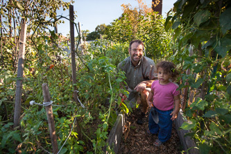 Gardener Murray Lantner and his one-year-old daughter, Meitar, enjoy shoveling, planting, and reaping the garden's rewards.