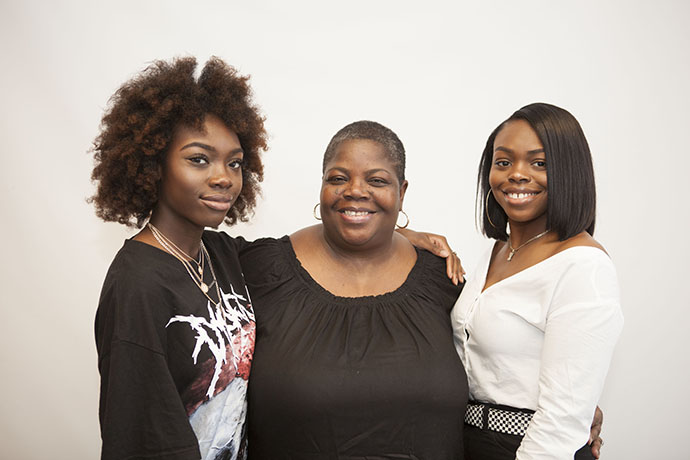 Urban sustainability major Deborah Alves (center) with daughters Abigail (left), who is majoring in health and nutrition sciences and Anisee, who is graduating this May with a bachelor’s degree in psychology. (Photo by David Rozenblyum)
