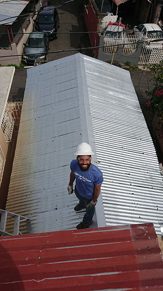 Senior Jonathan Cabral working on a rooftop in Puerto Rico. 