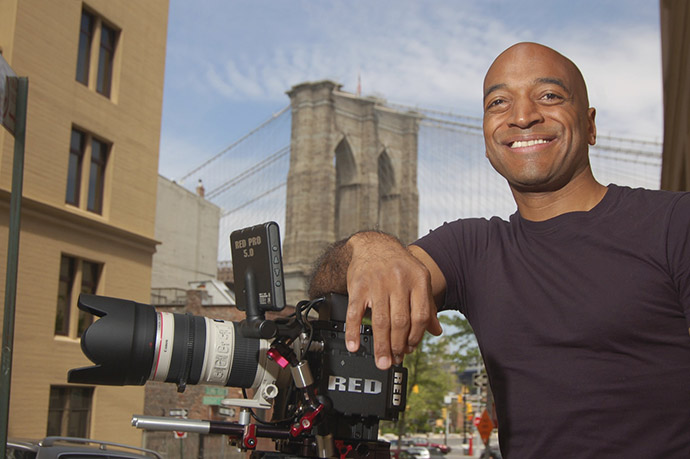 Emmy Award-winning director and Brooklyn College film lecturer Mustapha Khan utilizes the art form to amplify often overlooked stories. 'My work is about embracing humanity. Whether I'm shooting a movie or a commercial, kids or adults, Muppets or manatees, celebrities or everyday people, my job is to illuminate what's beautiful inside of us all.' (Photo credit: Steve Potter, <em>Harvard Magazine</em>)