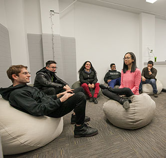 Students test out the bean bags in the new Room for Quiet Reflection.