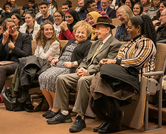 A lighter moment with the audience. Andrew Burian is seated with his wife Ruth. President Michelle Anderson is at far left.
